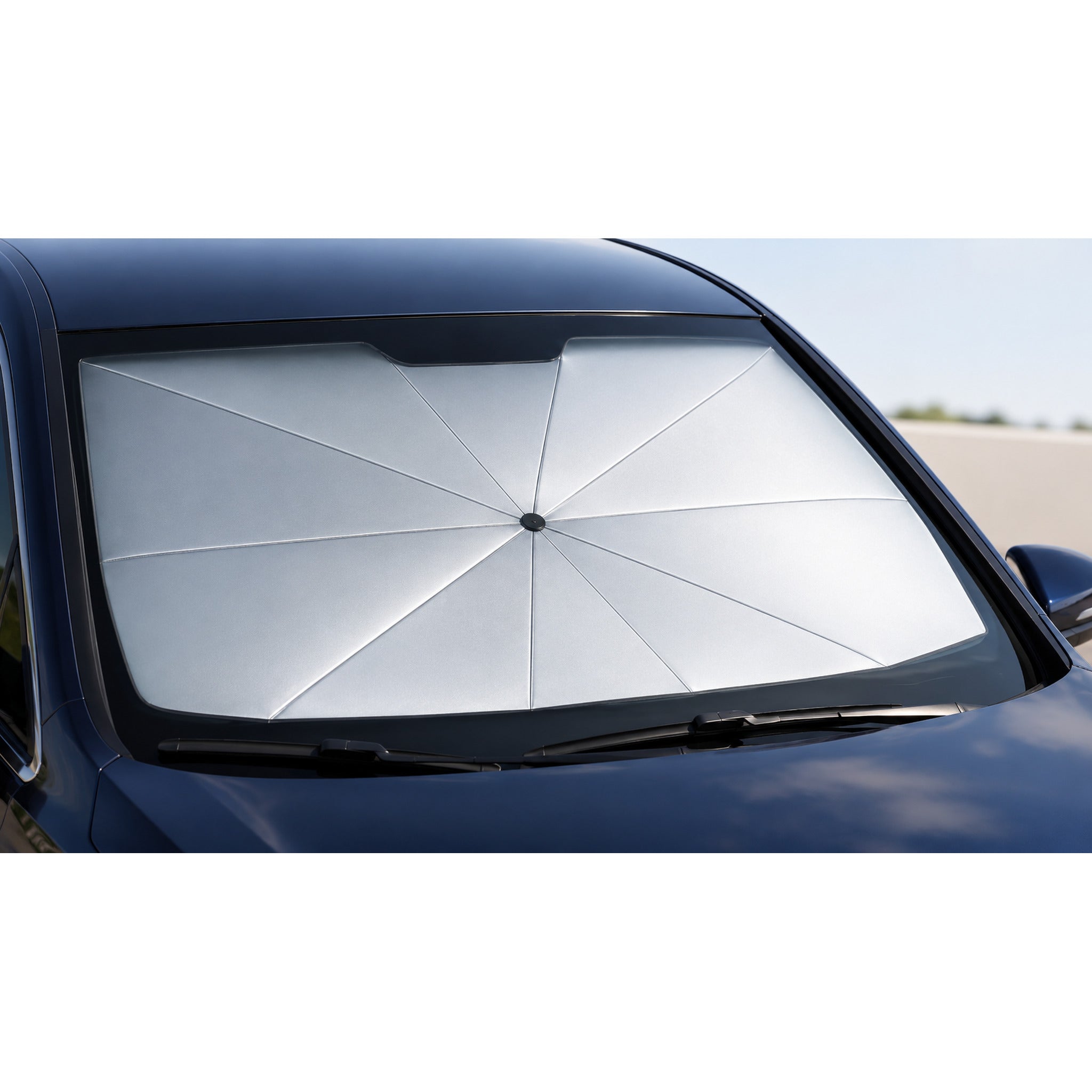 Close-up of the Luvenzo AutoShade silver reflective canopy filling a car windshield
