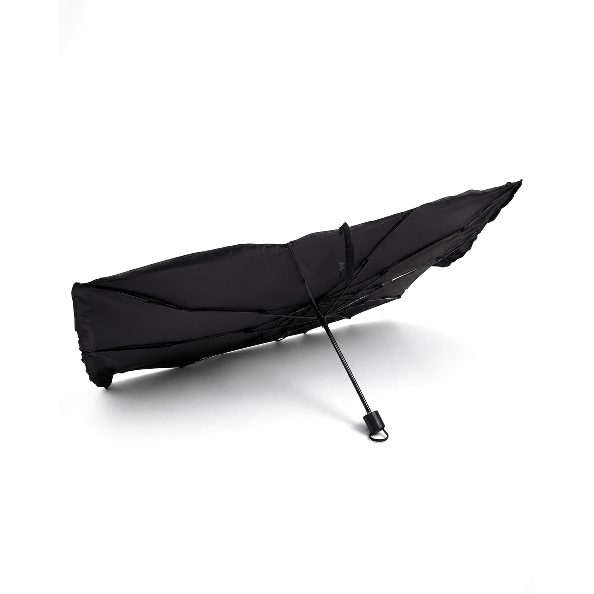 Luvenzo AutoShade folded down to a compact umbrella that fits in the car door pocket